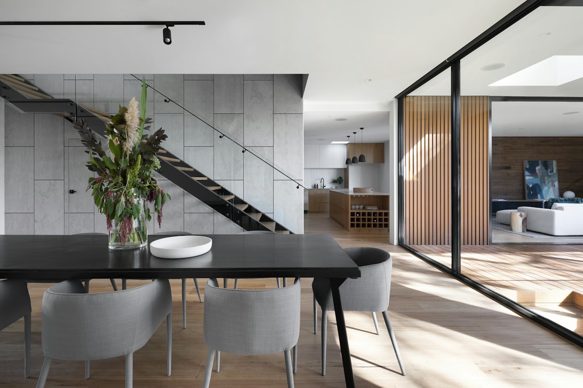 Open-plan dining room and kitchen inside a Christchurch home — about Arthur Paine Removals