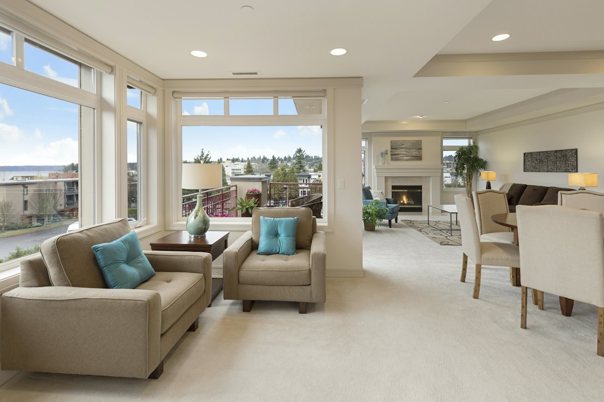 Bright apartment living room with armchairs — apartment and unit moves in Christchurch